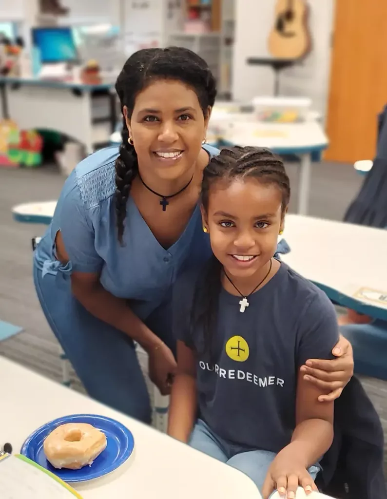 mother and daughter - donut event - volunteer